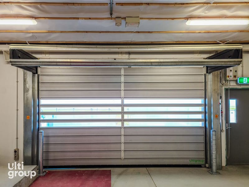 Internal view of an Ulti Spiral Door installed in a warehouse facility.